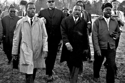 Harry Benson, John Lewis, Dr. Martin Luther King, Jr., & Ralph Abernathy singing “We Shall Overcome”