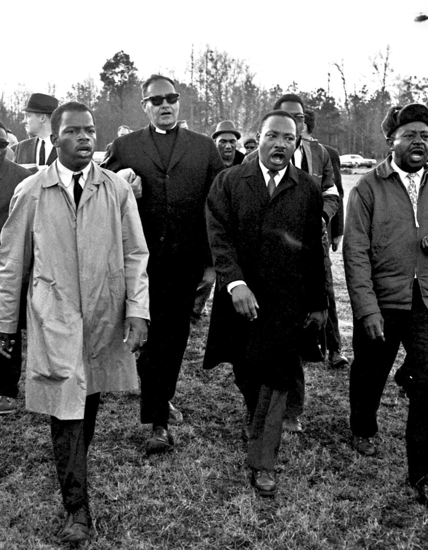 Harry Benson, John Lewis, Dr. Martin Luther King, Jr., & Ralph Abernathy singing “We Shall Overcome”